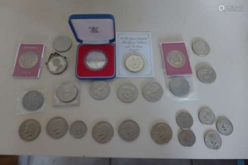 A small collection of commemorative coins, and six post 1970's Dollars, two half Dollars and three