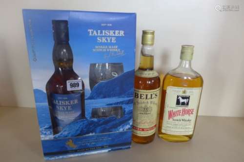 A Talisker Skye Atlantic Challenge boxed whisky and glass set, a bottle of Bells Old Scotch whisky