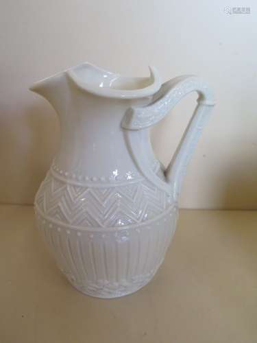 A Belleek harp handled jug, 16cm tall, generally good apart from small ships to rim