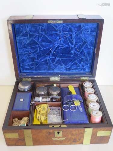 A 19th century brass bound walnut sewing box with contents