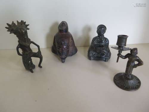 A Benin bronze style seated Chieftan, spelter Chinese figure, and bronze candlestick together with