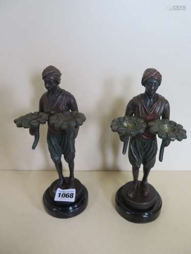 A pair of reproduction figures, 23cm tall