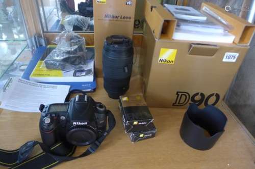 A Nikon D90 camera Serial No 6449527 with original box, CD, all papers and a Nikkor Lens Af-5