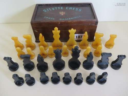 A Greys of Cambridge Silette chess set in Catalin polymer, black and amber colour, complete and in