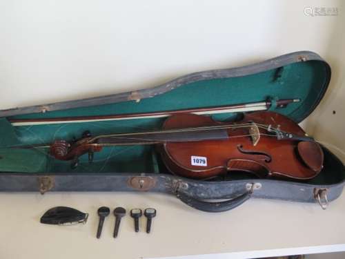 A late 19th/early 20th century violin in case with bow, mother of pearl inlay to tailpiece, also