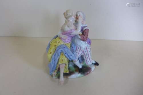 A Meissen group of gallant and companion embracing, 15cm tall - good condition