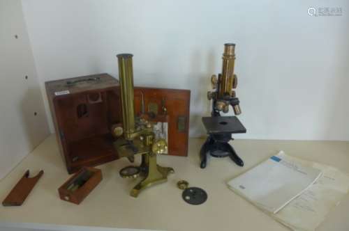 A brass microscope, engraved Hancock Optician, with box and slides, and an Ernst Leitz Welzlar