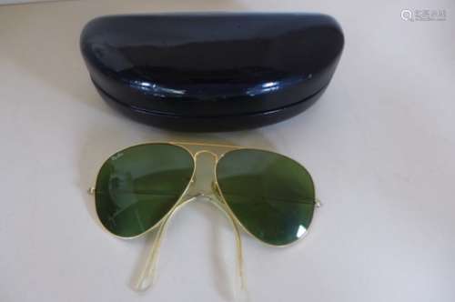 A pair of Ray Ban Aviator type sun glasses
