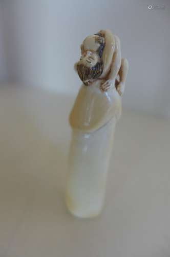 A Japanese Meiji period, early 1900's signed ivory erotic netsuke, signed to base, signature inked