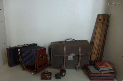 A Thornton Pickard amber mahogany plate camera with two lens plates, carry case, and tripod