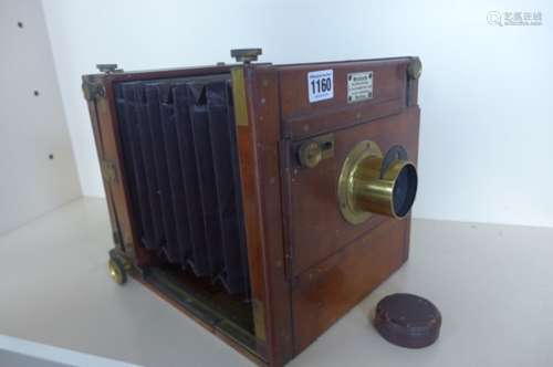 A Meacher mahogany plate camera with maroon bellows