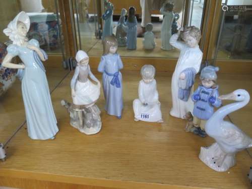 Five Nao figures, a Lladro girl with rabbit, and a similar figure, all good