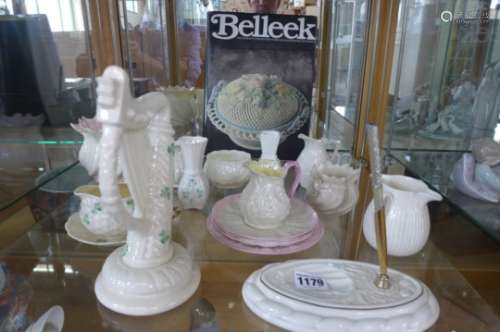 Eighteen pieces of Belleek pottery and a reference book on the subject, all appear good, apart
