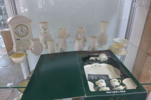Fourteen pieces of Belleek pottery and a Shamrock miniature tea set, all good