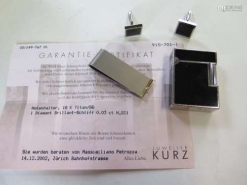 A titanium money clip set with a small diamond 0.03ct colour H SI1, approx 9 grams, a Dupont gas