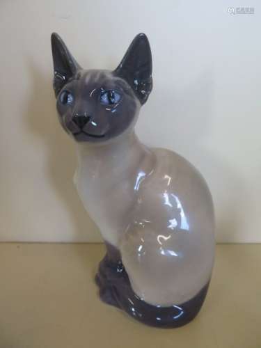 A Royal Copenhagen China Siemese Cat reference No 142 - designer Theodore Madsen, height 18cm,