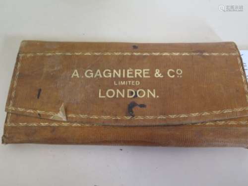 A Victorian and later leather A Gagniere stamp folio with stamps including Penny Reds, Victorian,