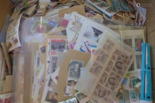 a large collection of stamps on piece and loose, in bundles and in glassines/packets ? literally