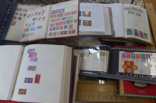 A collection of world stamps, in eight albums with some loose and three Stanley Gibbons catalogues