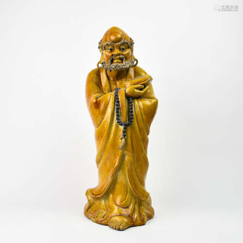 A Chinese Yellow Glazed Porcelain Figure