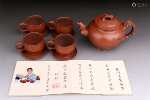 A Set of Chinese Carved Yixing Clay Tea Pot and Cups