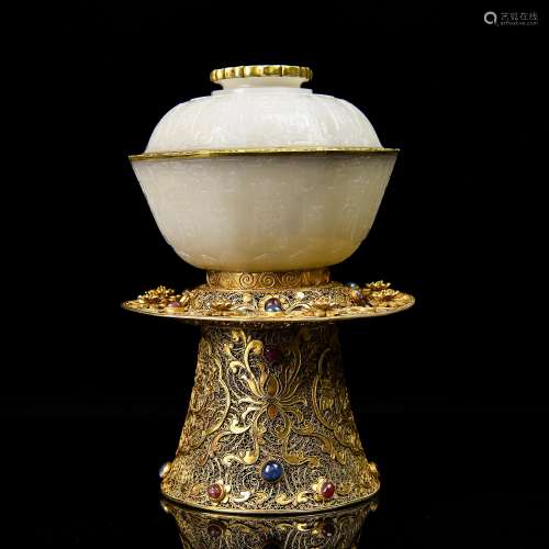 A Chinese Carved Jade Bowl with Gilt Bronze Stand