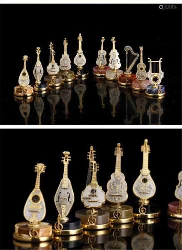 A Set of Italian Carved Crystal Instruments Decorations