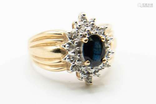 A 10CT YELLOW GOLD, SAPPHIRE AND DIAMOND RING, the oval