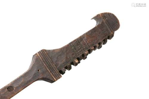 A CARVED WOODEN CLUB, POSSIBLY NATIVE AMERICAN, the