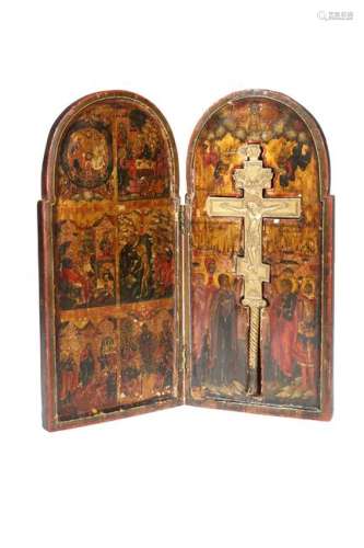 A RUSSIAN DIPTYCH ICON, the two hinged arch-topped