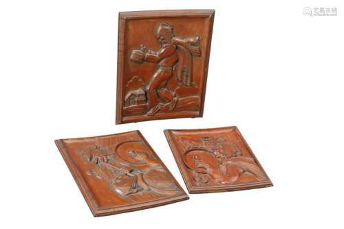 A SET OF THREE SOUTH AMERICAN CARVED WOODEN PANELS,