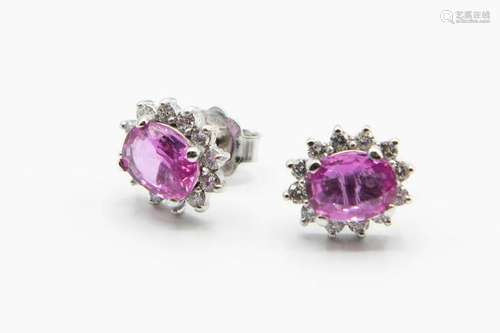 A PAIR OF PINK SAPPHIRE AND DIAMOND EARRINGS, the oval