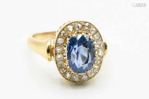 A CEYLON SAPPHIRE AND DIAMOND RING, the oval cut