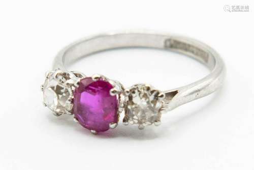 A PLATINUM, BURMESE RUBY AND DIAMOND RING, the oval cut