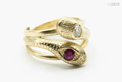 A DIAMOND AND RUBY SET SNAKE RING, the coiled band as