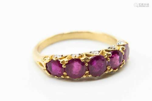 A LATE VICTORIAN RUBY SET RING, the five graduating