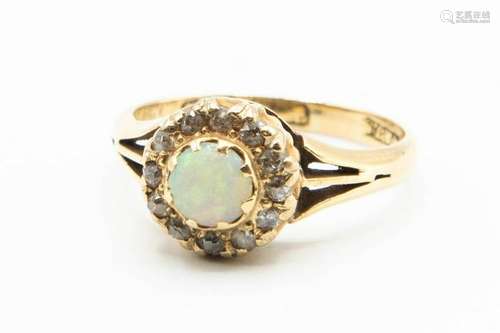 A VICTORIAN OPAL AND DIAMOND RING, the single round