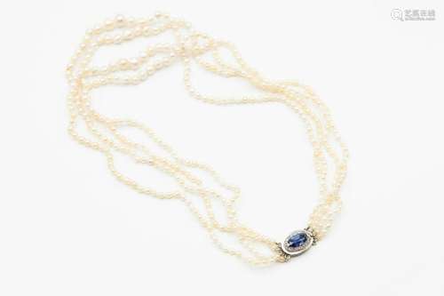 A NATURAL SALTWATER PEARL NECKLACE, the four graduating