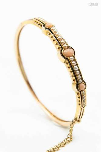 A LATE 19TH CENTURY CORAL AND SEED PEARL BANGLE, the