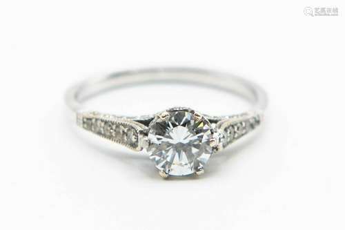 A DIAMOND SET RING, the single brilliant cut diamond in