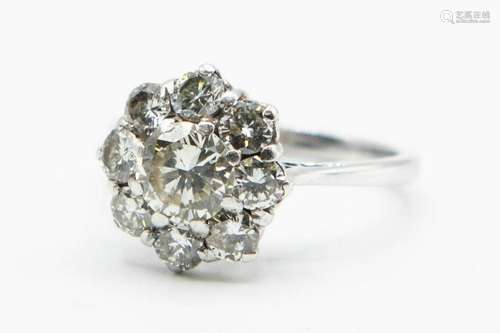 AN 18CT WHITE GOLD AND DIAMOND RING, the principle