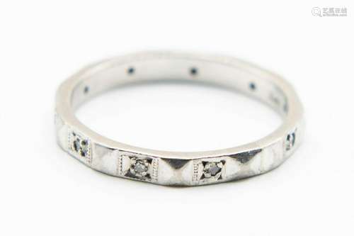 AN 18CT WHITE GOLD RING, the eternity style band set