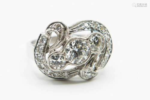 A DIAMOND SET DRESS RING, the large oval twisted detail