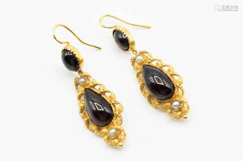 A PAIR OF GARNET AND SEED PEARL SET EARRINGS, the oval