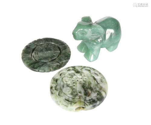 TWO CHINESE CARVED JADE ROUNDELS, the first a pendant,