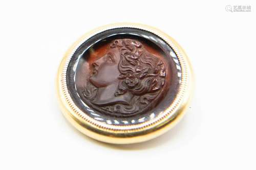 A CARVED CARNELIAN INTAGLIO, the circular carnelian