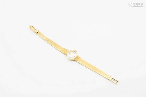 A LADY'S 18 CARAT GOLD SEIKO BRACELET WATCH. Circular