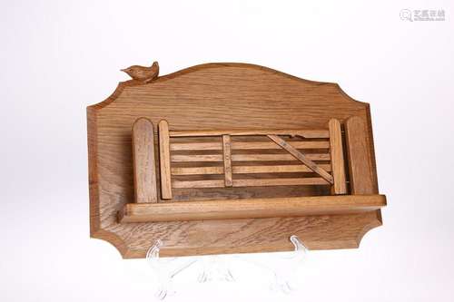 BOB HUNTER  A WRENMAN OAK LETTER RACK, modelled as a