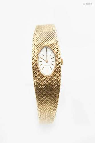 A LADY'S 9CT GOLD OMEGA BRACELET WATCH.Â Â Oval silver