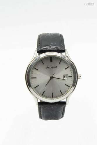 AN ACCURIST STAINLESS STEEL WRIST WATCH, the silvered